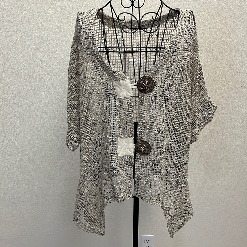 Tan speckled sweater with large buttons